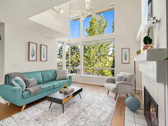 New flooring and paint highlight the sun-drenched main living space.