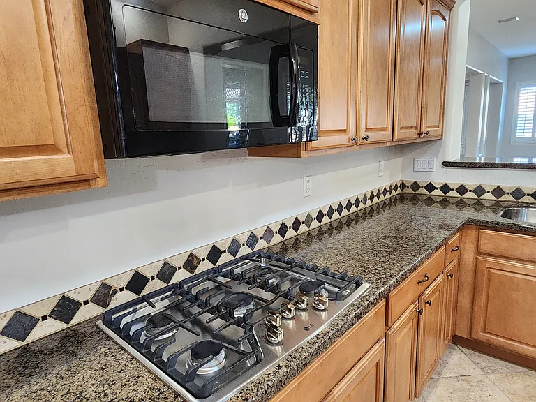 Newer gas range. Reverse osmosis sytem at kitchen sink.