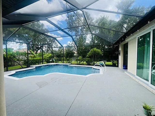 This could be where you relax and live your best Florida life!
Enormous caged lanai and salt water pebble tech pool. Handrail makes this accessible for all ages, and there is even a hanging deck TV (for convenience only) to enjoy while you float.