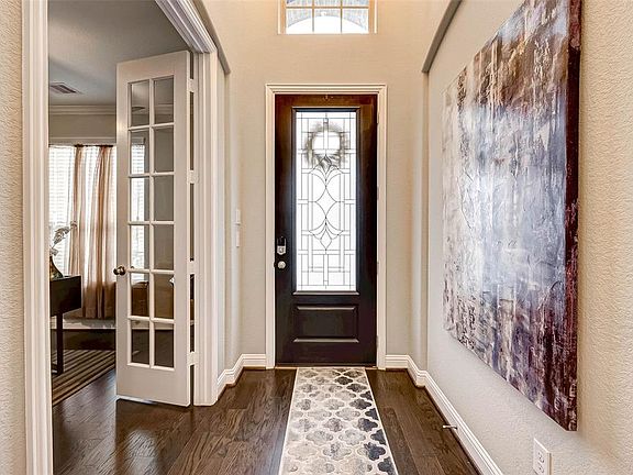 Family and friends will be wowed when they walk into the open foyer by the rich wood floors, and high ceilings. Enter through your wood and glass door that lets the sunshine through.