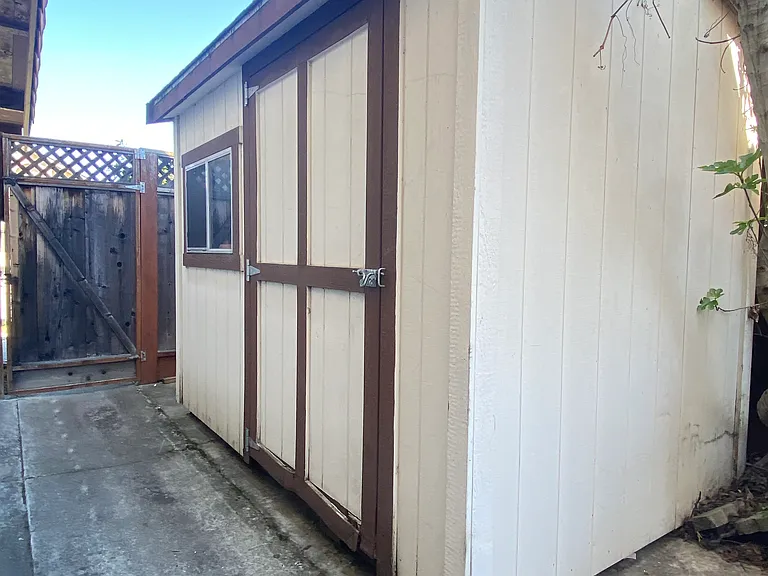 Oversized shed in side yard