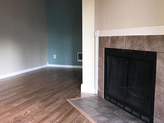 Fireplace, looking towards dining room.