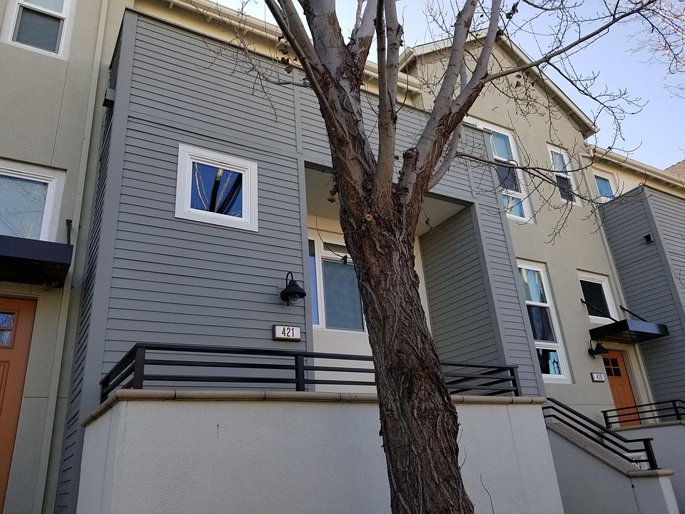 Front entrance faces the open green space