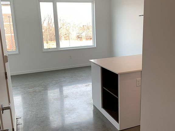 Entryway looking into Kitchen and Dining area