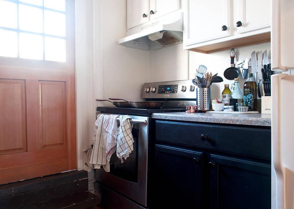 Kitchen area; door leads to outside private deck. Can eat outside May-September. AND grow Basil and tomates.