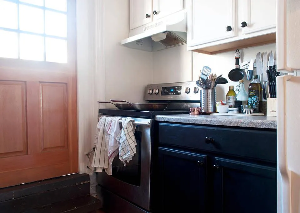 Kitchen area; door leads to outside private deck. Can eat outside May-September. AND grow Basil and tomates.