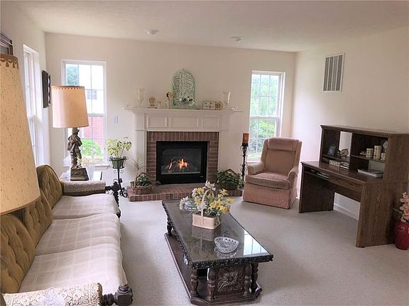 Family Room. Natural light flows into the space through numerous muti-pane windows.