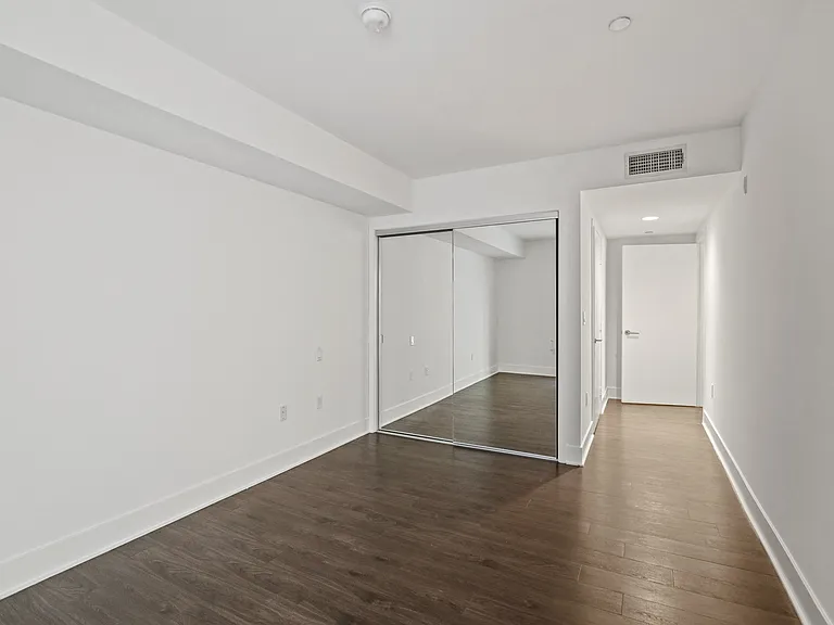 Bedroom with Mirrored Closet