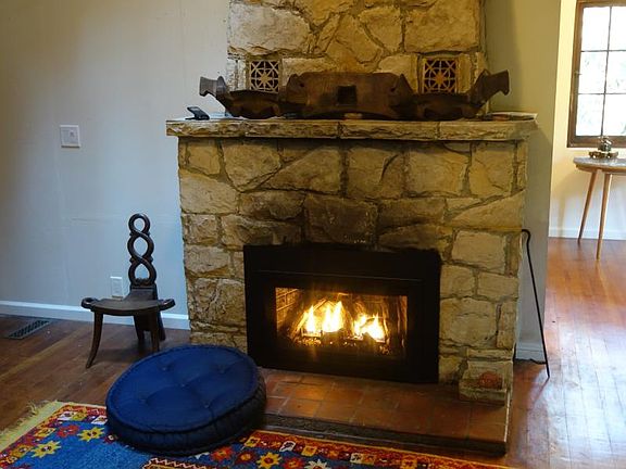 Cozy propane gas fireplace insert warms the living room