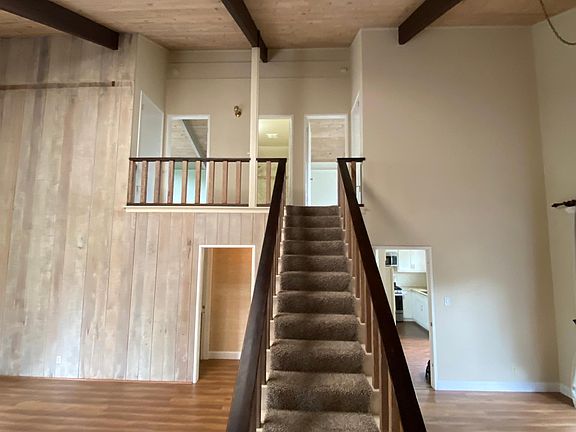 Staircase to two bedrooms and one bathroom