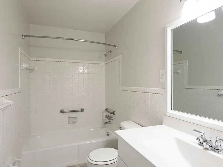Bathroom with handrails