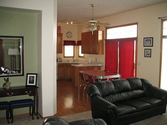 The open floor plan flows from the entry to the living room to the kitchen.