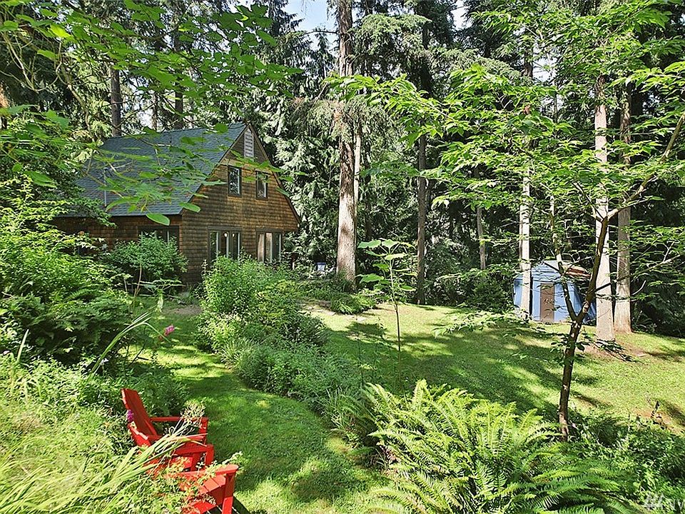 Serene private Whidbey Getaway, full time or part time, you will never tire of the quiet beauty of this home. This is the south facing side of the home. OPEN HOUSE SATURDAY (18TH) FROM 11AM-4PM