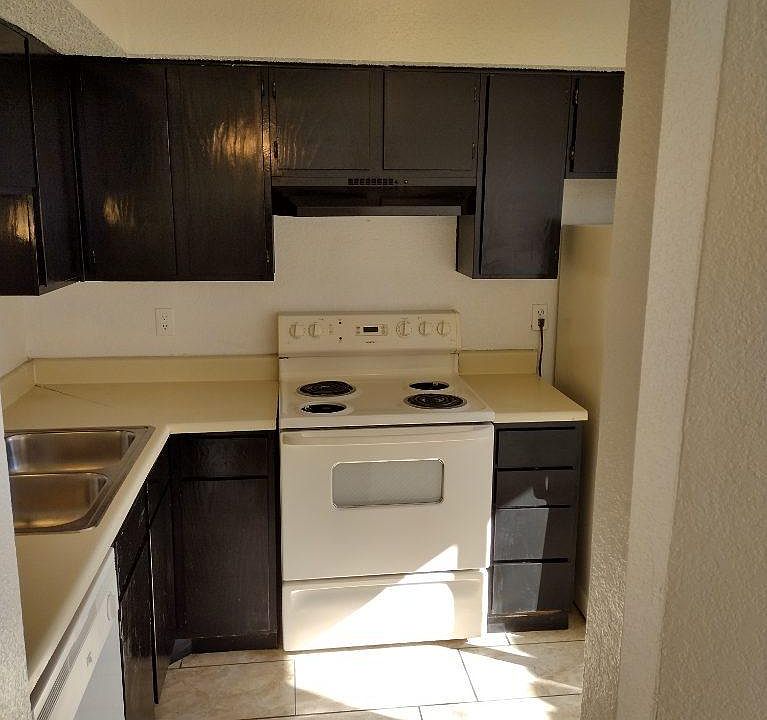Kitchen open to family room, dining room and balcony