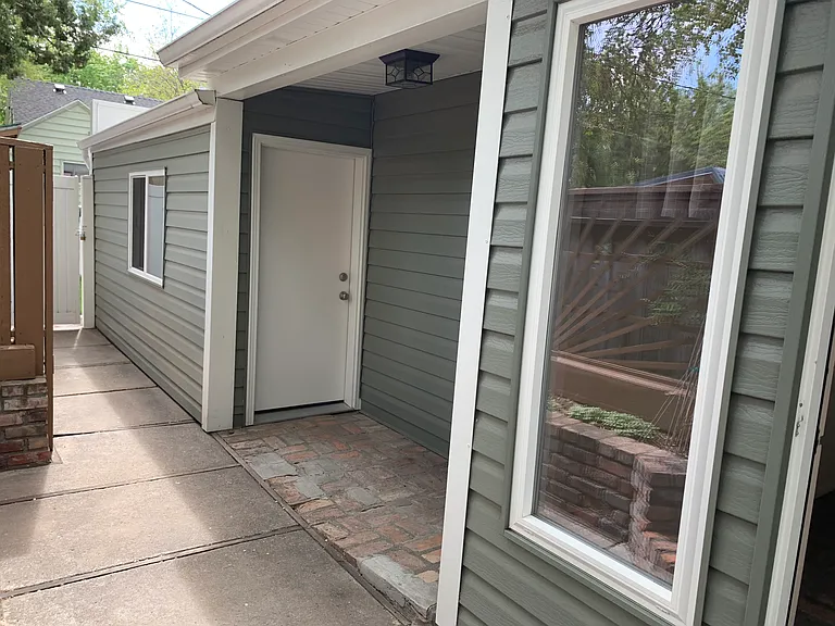 Grill nook with lighting, outlets and door into the garage