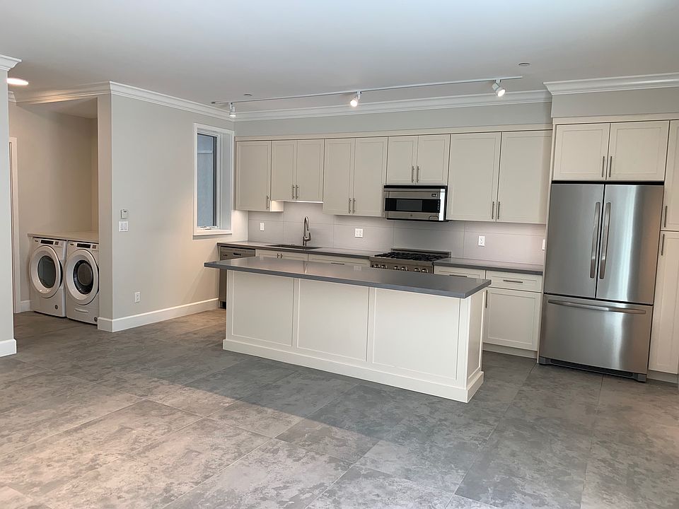 Kitchen with full size, stainless steel appliances
