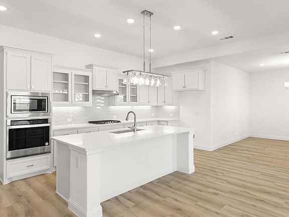 Parker floor plan featuring spacious family living, a private study, covered patio, and an upstairs