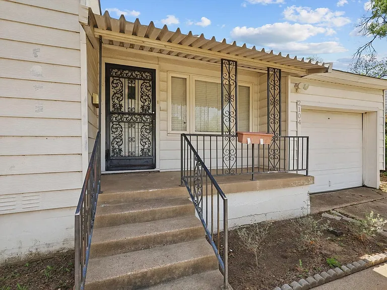 The quaint covered front porch is perfect for morning coffee or relaxing evenings