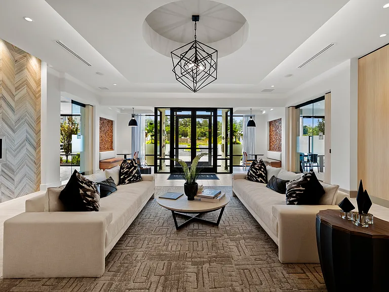 Resident lobby with cozy fireplace and ample seating ideal for remote working