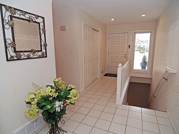 Inviting foyer leading to family rooms & bedroom wing
