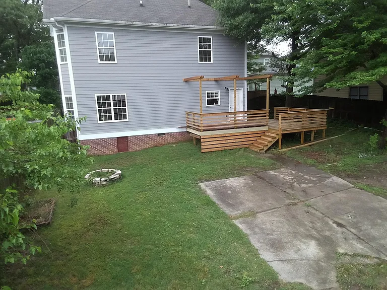 Rear of house with parking and private yard