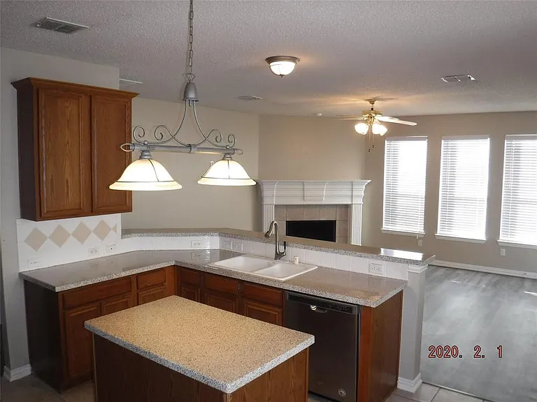 ISLAND AND OPEN BREAKFAST BAR TO DEN.