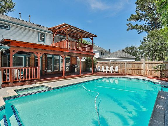 This amazing backyard space offers a sparkling saltwater and heated pool and spa, covered patio with extended decking and 2nd story balcony!