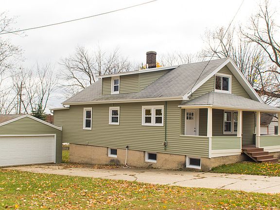 SIDE VIEW
						:
						2 car garage and side view of home from street.