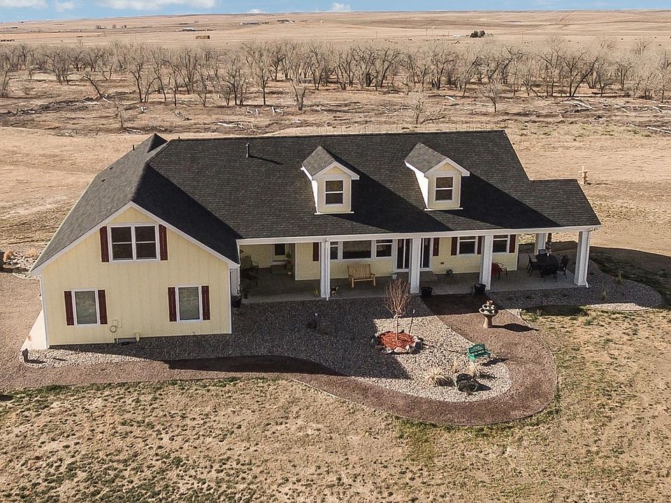 Front View of Property with Bijou Creek and Front Range Mountains to the West