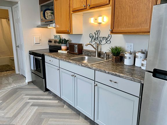 Brand new lower cabinets, new countertop, new sink and faucet!