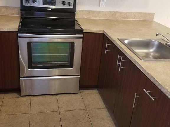 plenty kitchen cabinets under and above the counter