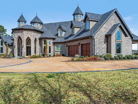 Lots of parking with this 3 car garage and porte-cachere with custom wood ceiling. More than enough roof for guests when entertaining.