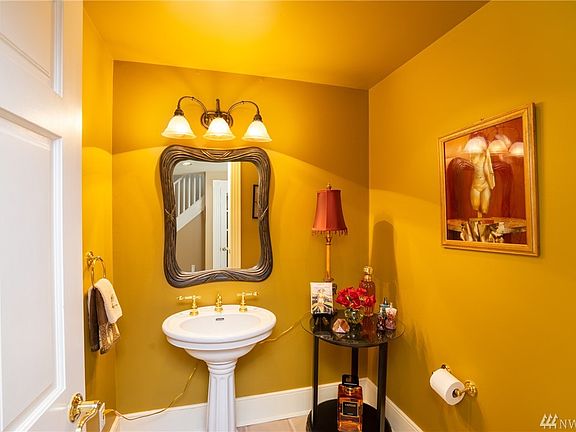 Main floor powder room is private yet convenient. 