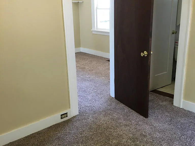 From Bed RM looking into Living Rm. Bath Room behind White door.