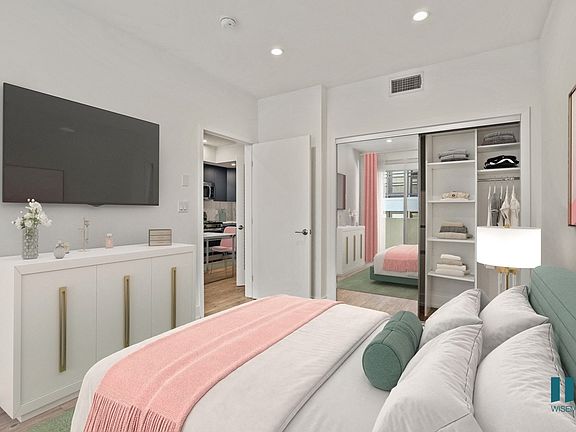 Bedroom with Mirrored Closet with Built-In Shelving