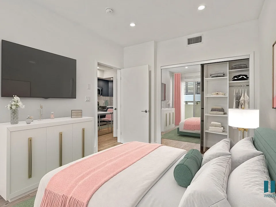 Bedroom with Mirrored Closet with Built-In Shelving