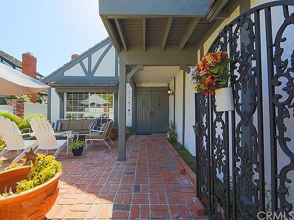 Charming and Sunny is this gated front entry courtyard. Perfect for morning or afternoon entertaining.