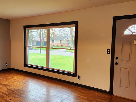 View from kitchen to livingroom and main door.