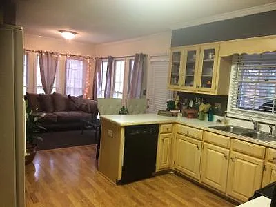 Kitchen is equipped with enough space for living room comfort.