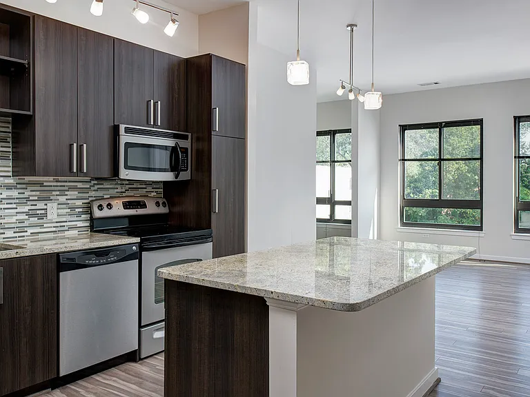 Large living area with wood flooring throughout