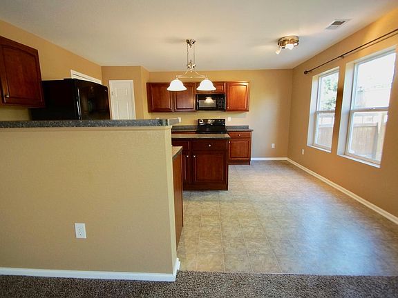Living Room leads to Eating Area and spacious Kitchen.