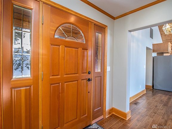 Lovely front entry- solid wood doors throughout. Check out the beautiful hardwood floors & nice wood trim throughout! 