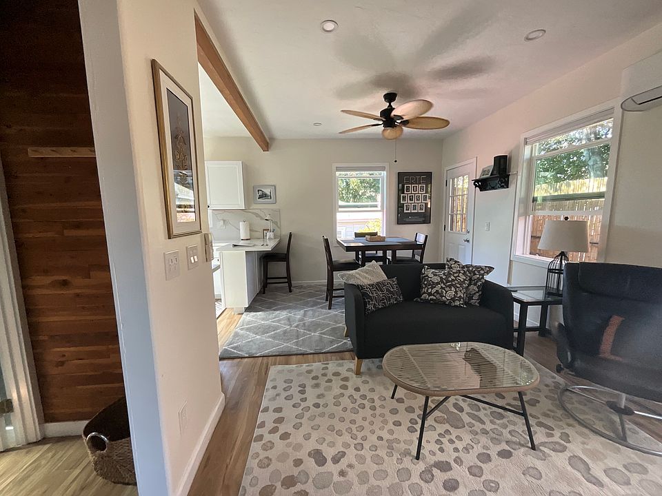 Open floor plan living room, dining area, breakfast bar
