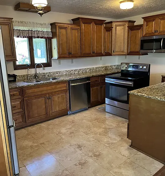 Kitchen with updated appliances and flooring