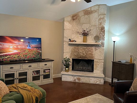 Large open living area with lots of light! Stained concrete florrs throughout the house.