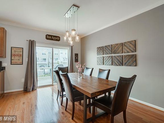 Open Concept Dining Room leads to Deck in Rear
