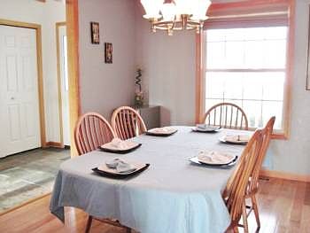 Formal dining room off the entry opens into the kitchen as well.