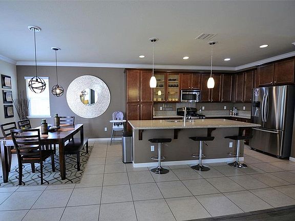 Staged kitchen & dining area (furnishings not included)