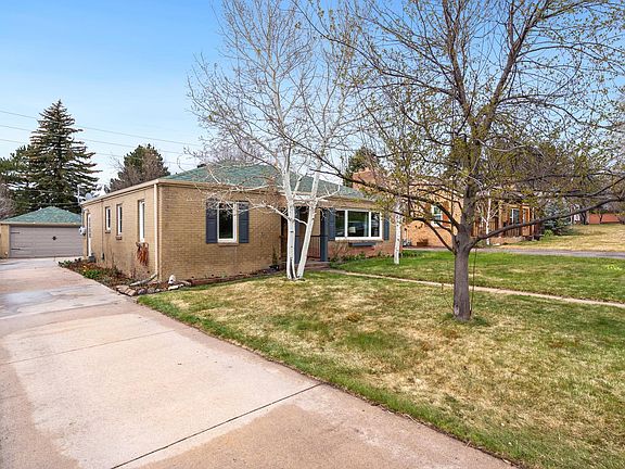 Long driveway leads to double car garage