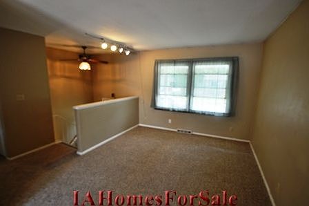 Living Room on upper level has lots of natural light and new carpet just installed on upper level.